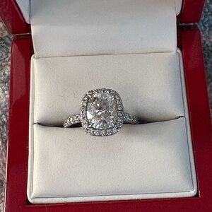 Moissanite center stone 3.5 carat -18 kt gold setting with diamonds